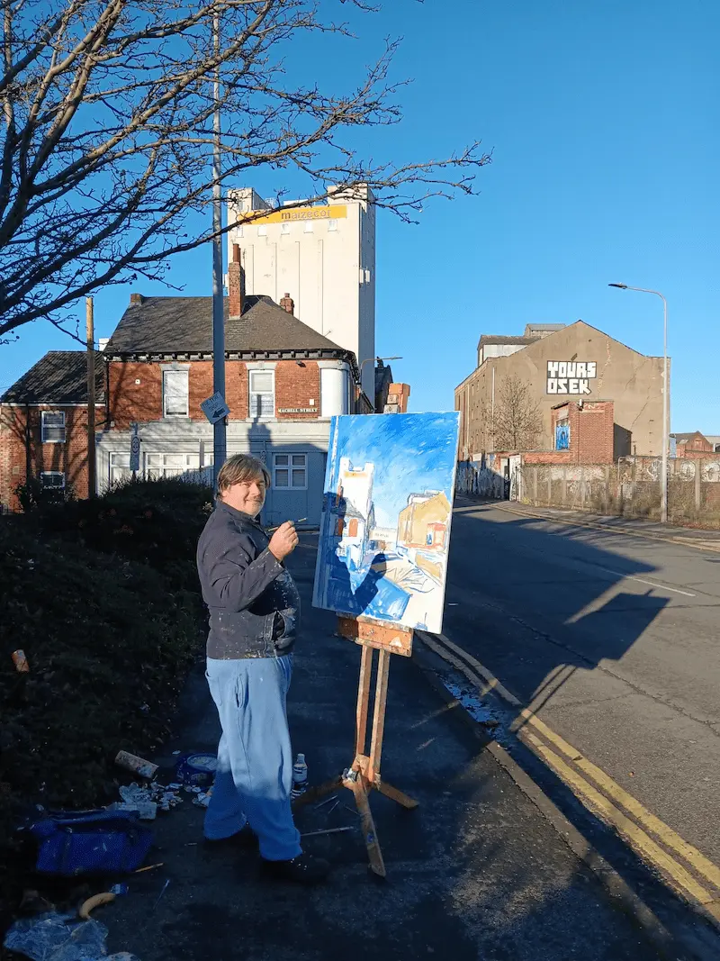 Mark Rodgers painting the Maizecor building on Wincolmlee, Hull