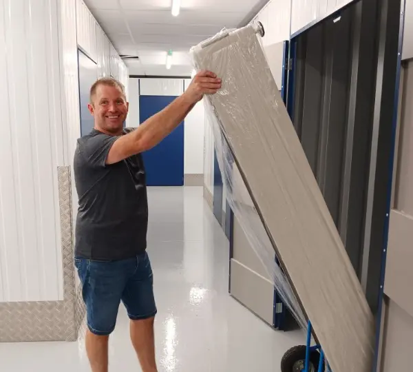 Student moving furniture in to storage